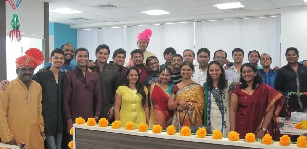 Focalworks employees posing for a group photo in traditional attire.