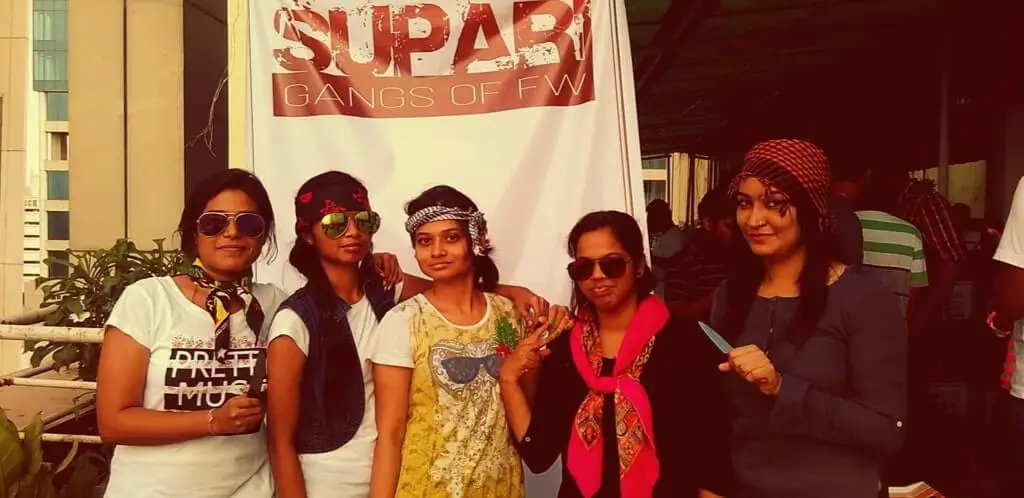 a group of women posing in a mix of casual and funky attire, exuding a sense of camaraderie and style.